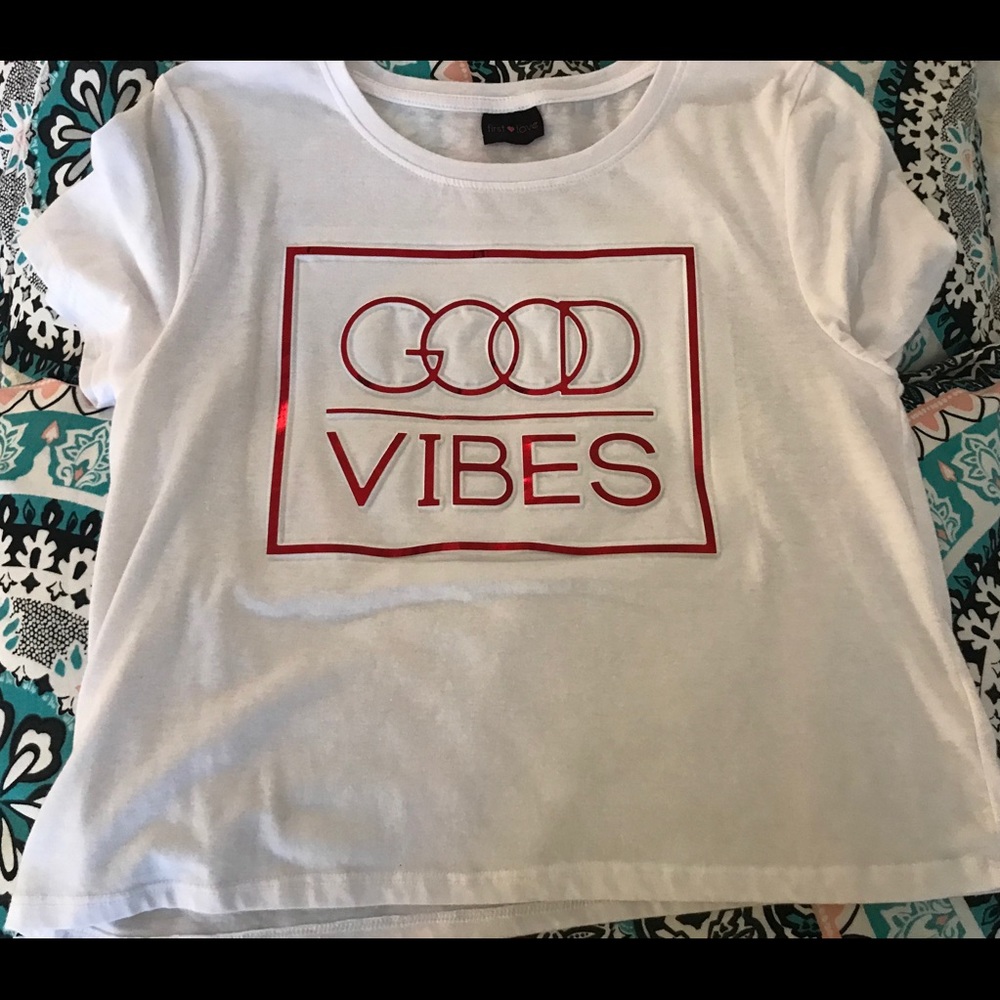 White shirt with red writing